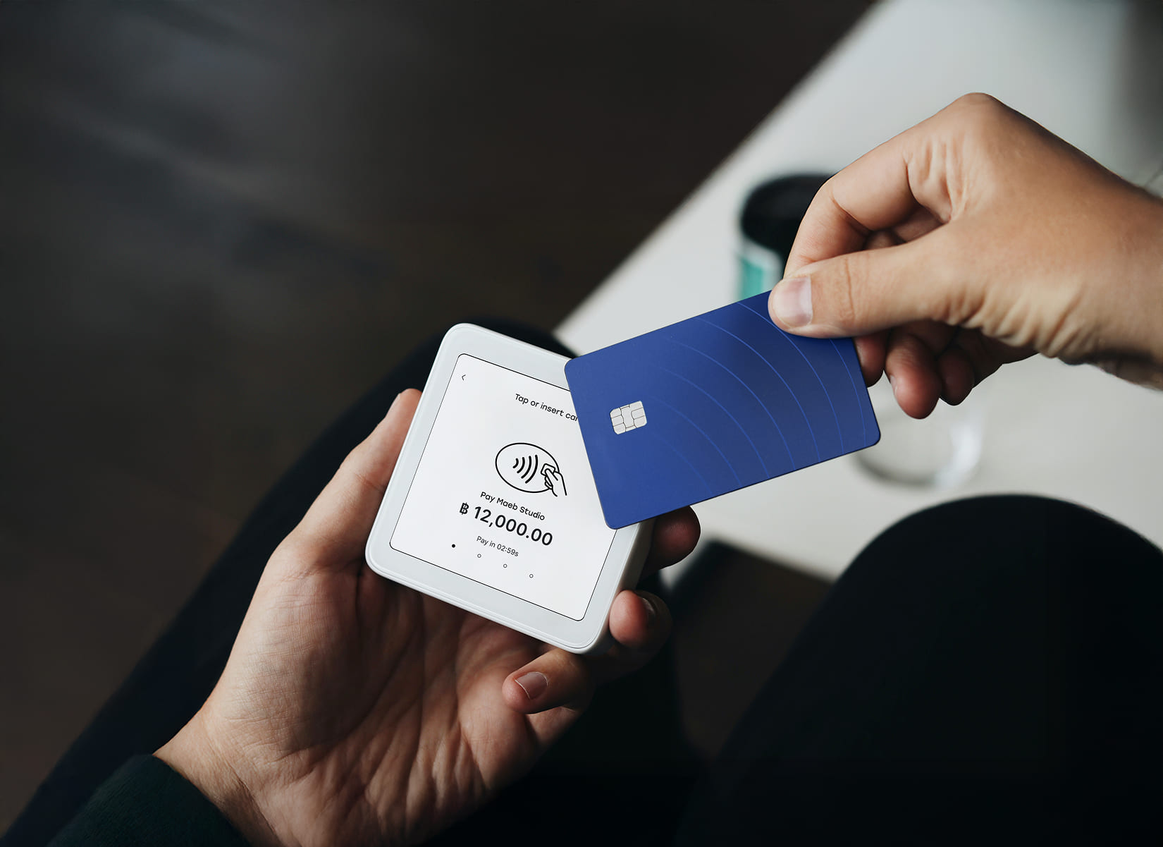 White payment terminal mounted on a wall, showing "Payment successful!"